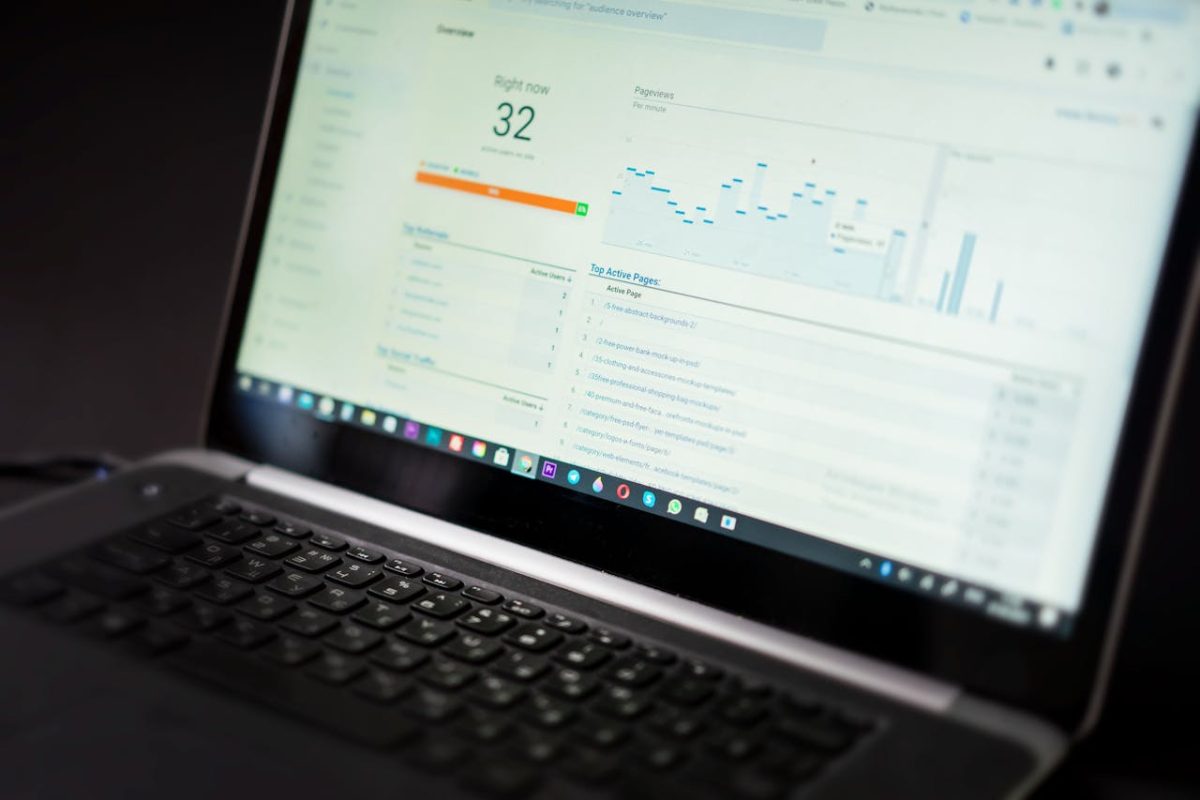 A close-up shot of a laptop screen displaying website data, representing the role of optimized web design and SEO strategies in improving search rankings.