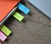 A close-up of sticky notes and a pencil on a notebook, symbolizing planning and strategy for improving SEO rankings and website optimization.